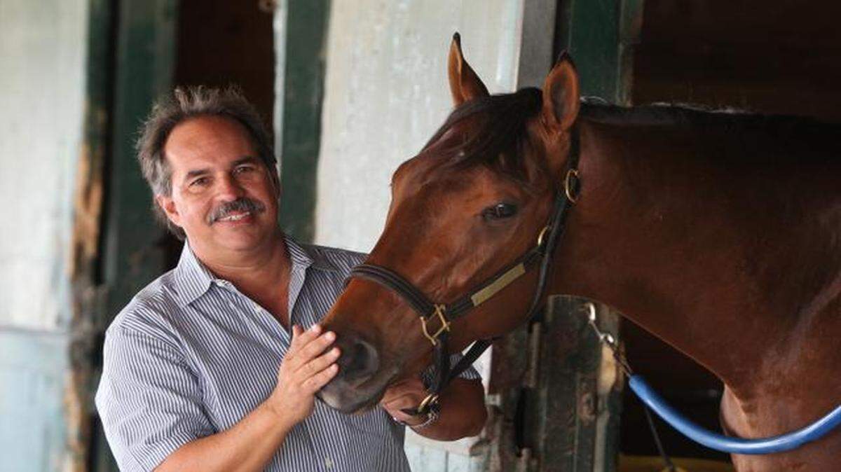 
Race horse trainer Jose Garoffalo with his colt, Wildcat Red, at Gulfstream racetrack, Friday, April 18, 2014. 
