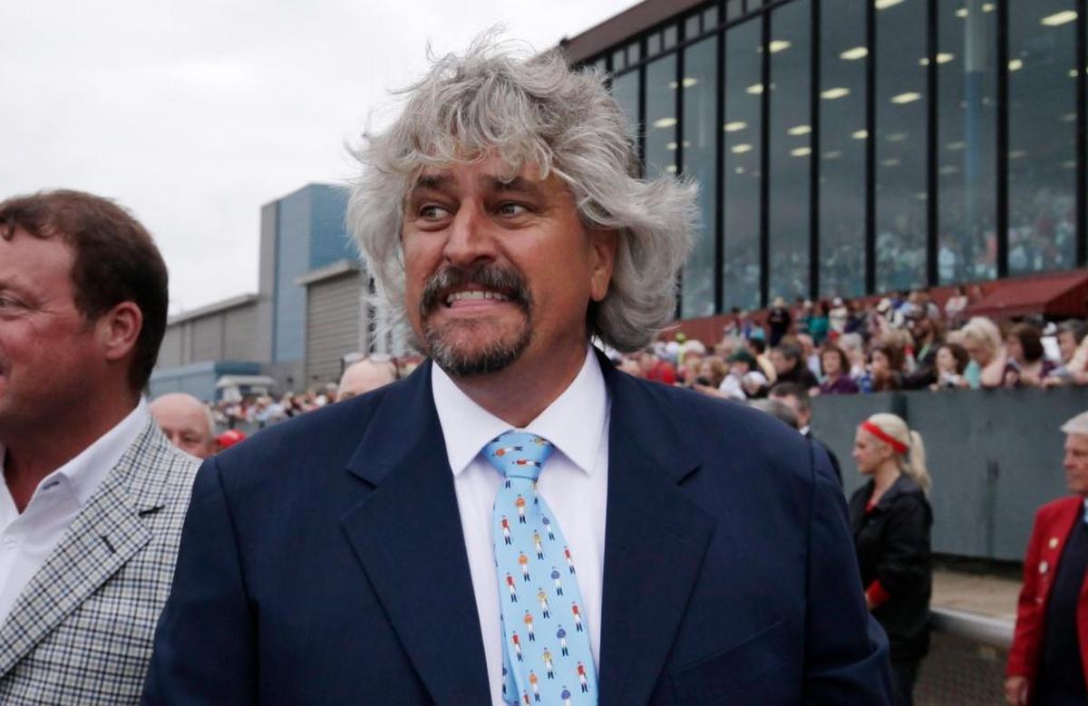Trainer Steve Asmussen celebrates after Creator won the Arkansas Derby horse race at Oaklawn Park in Hot Springs, Arkansas, on April 16, 2016.