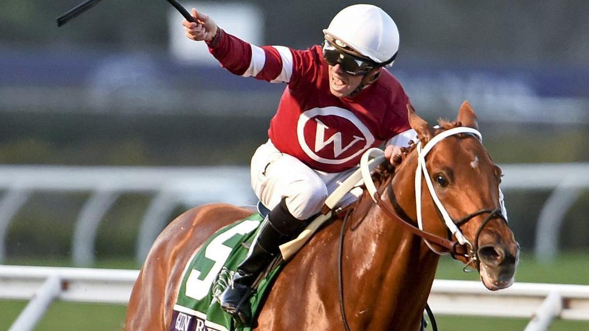 Jockey Florent Geroux celebrates as Gun Runner heads to the wire to win in the Breeders’ Cup Classic in Del Mar, California.