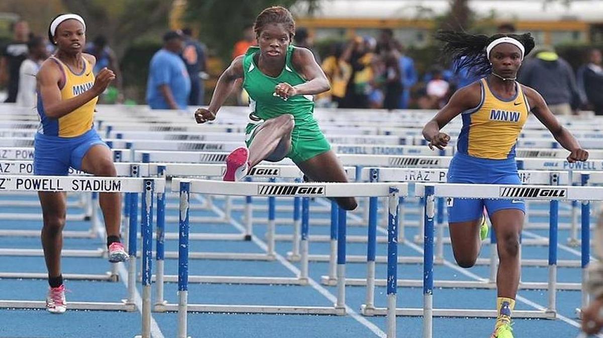 Miami Jackson High School’s Tiara McMinn wins in the girls 100-meter hurdles during the GMAC Track and Field Championship at Traz Powell Stadium in North Miami on Saturday, March 25, 2017.