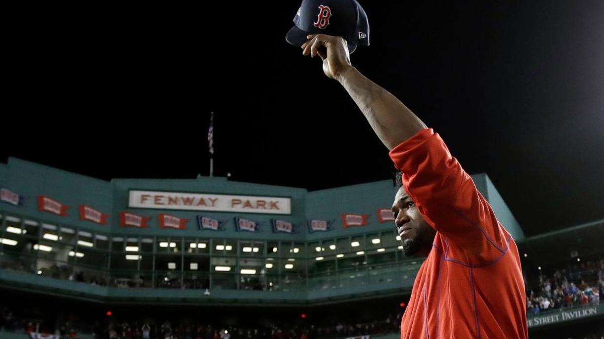 Boston’s David Ortiz waves from the mound at Fenway Park after his final game with the Red Sox on Monday night.