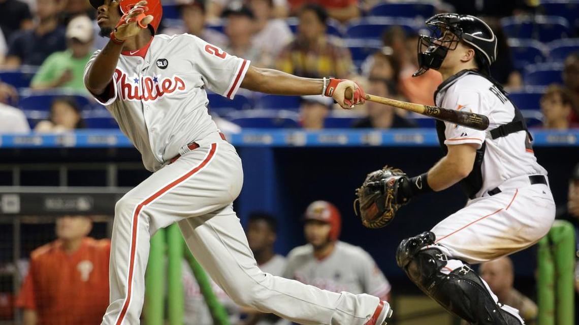 
Philadelphia Phillies’ Darnell Sweeney watches after popping out to second in the fifth inning against the Miami Marlins on Thursday, Aug. 20, 2015, in Miami. At right is Miami Marlins catcher J.T. Realmuto.

