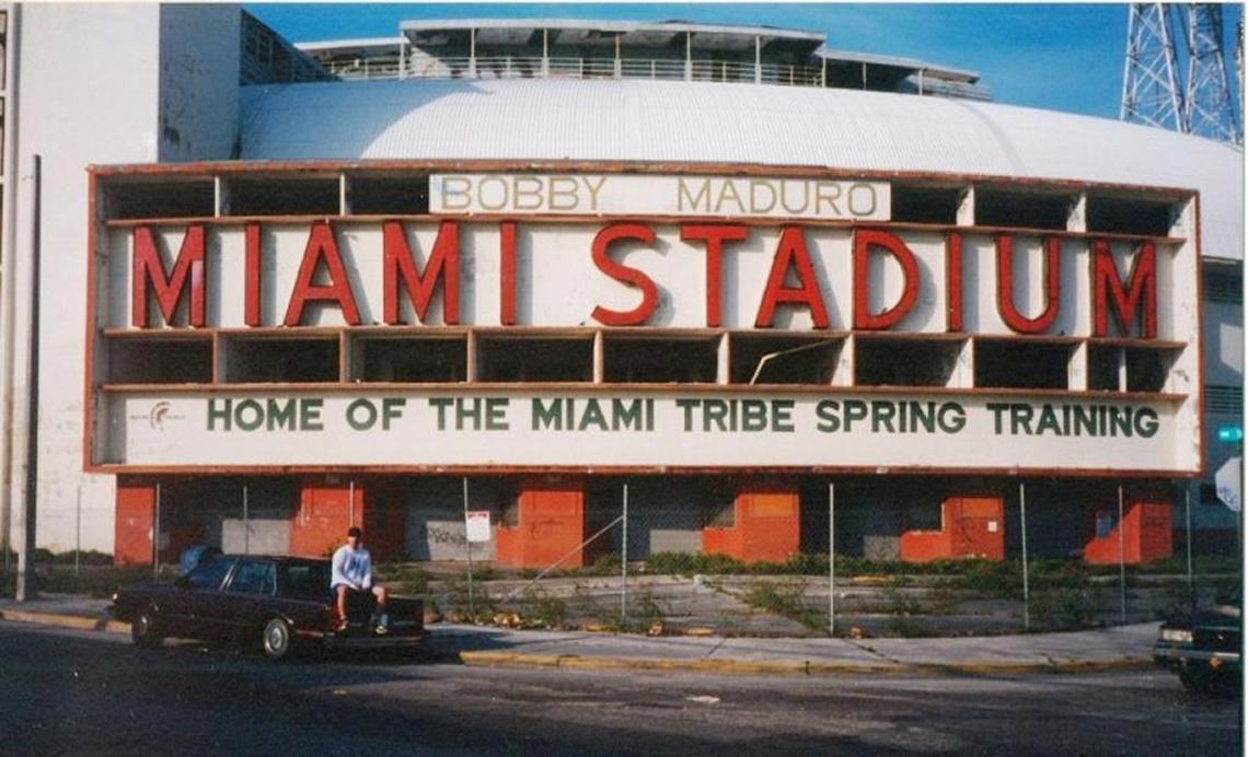 Abel Sanchez sits in front of the Bobby Maduro Miami Stadium in 2001 before the baseball park was torn down to make way for affordable housing in Miami. Sanchez used this image on his GoFundMe campaign to raise $2,500 to install a historic marker on the site.