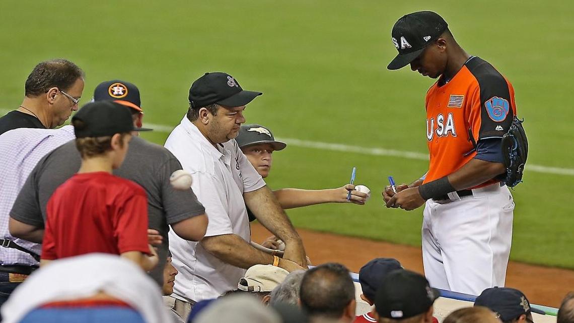 The U.S. teams #20 Lewis Brinson signs autographs prior to the 2017 SIRIUSXM All-Star Futures Game at Marlins Park in Miami on Sunday, July 9, 2017.