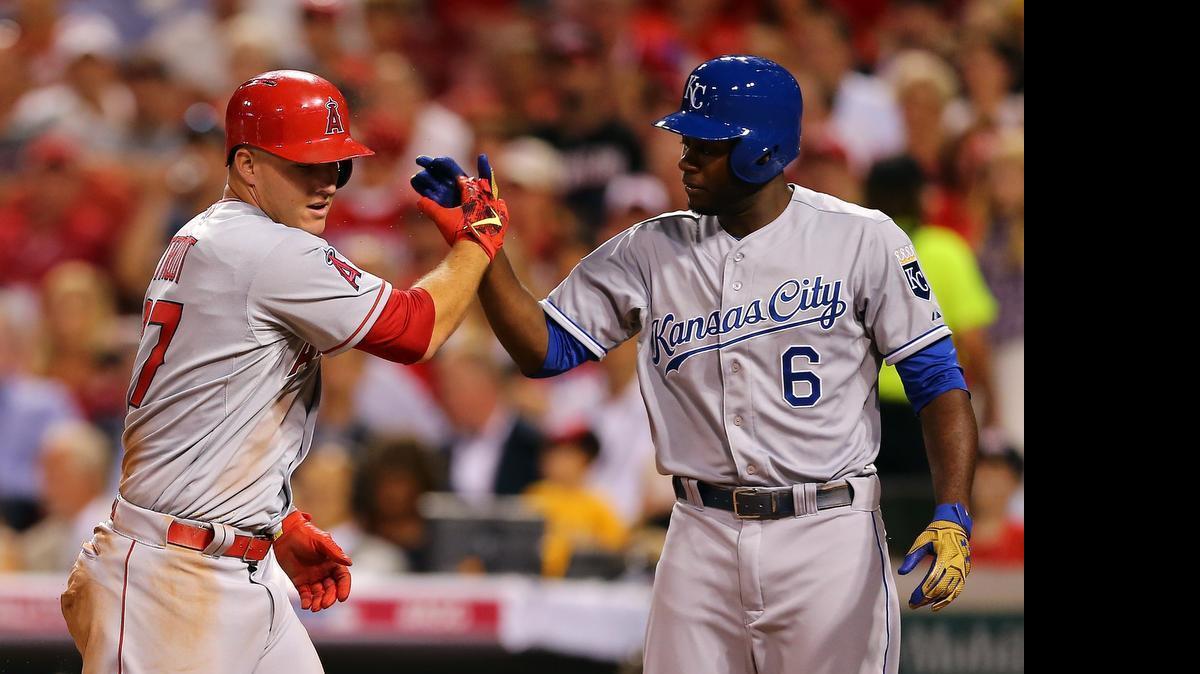 
American League All-Star Mike Trout, left, of the Angels celebrates with teammate Lorenzo Cain of the Royals after scoring off Prince Fielder’s single during the All-Star Game at the Great American Ball Park on July 14, 2015 in Cincinnati, Ohio.
