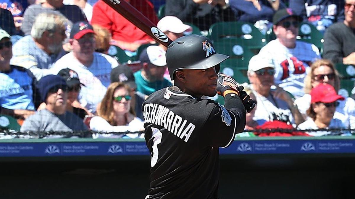 Miami shortstop Adeiny Hechavarria singles in the second inning a spring training game in Jupiter on March 15, 2017.