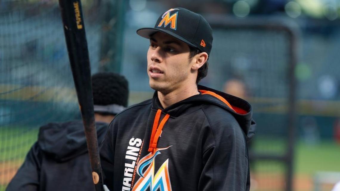 Miami Marlins center fielder Christian Yelich steps out of the cage during batting practice before the team's baseball game against the Colorado Rockies in Denver. The Marlins sent Yelich to the Milwaukee Brewers for four prospects on Thursday, Jan. 25, 2018.