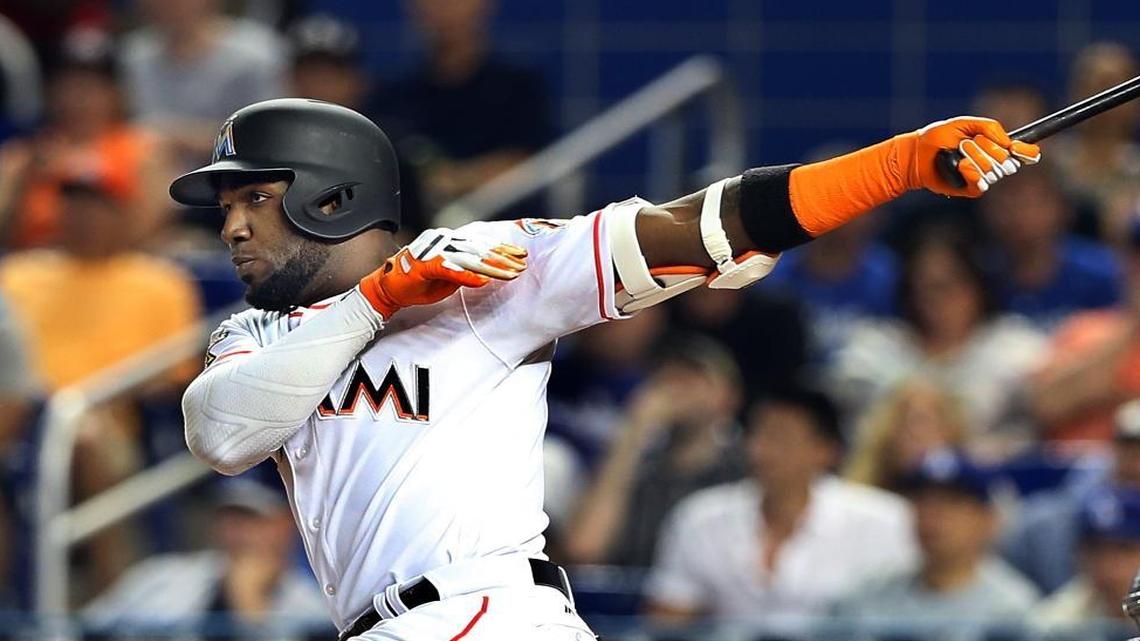 Miami Marlins' left fielder Marcell Ozuna hits a single in the first inning of the Miami Marlins vs Los Angeles Dodgers game at Marlins Park in Little Havana in Miami on Fri., July 14, 2017.