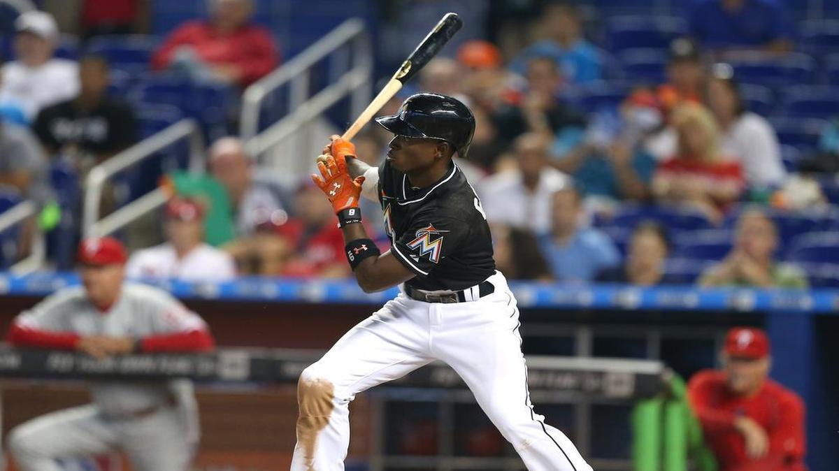 
Miami Marlins second baseman Dee Gordon hits a single in the fourth inning of a baseball game against the Philadelphia Phillies at Marlins Park in Miami on May 2, 2015.
