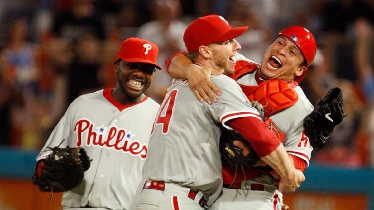 Philadelphia Phillies starting pitcher Roy Halladay, center, celebrates with Carlos Ruiz, right, and Ryan Howard after Halladay threw a perfect game during a baseball game against the Florida Marlins, Saturday, May 29, 2010 in Miami. Halladay died in a small plane crash in the Gulf of Mexico off the coast of Florida on Tuesday, Nov. 7, 2017.