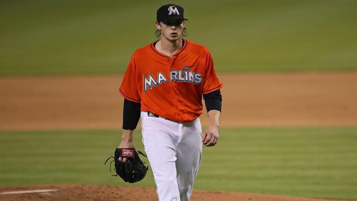 
Adam Conley #61 of the Miami Marlins walks off the field during the fourth inning the game against the Philadelphia Phillies at Marlins Park on August 23, 2015 in Miami, Florida. 
