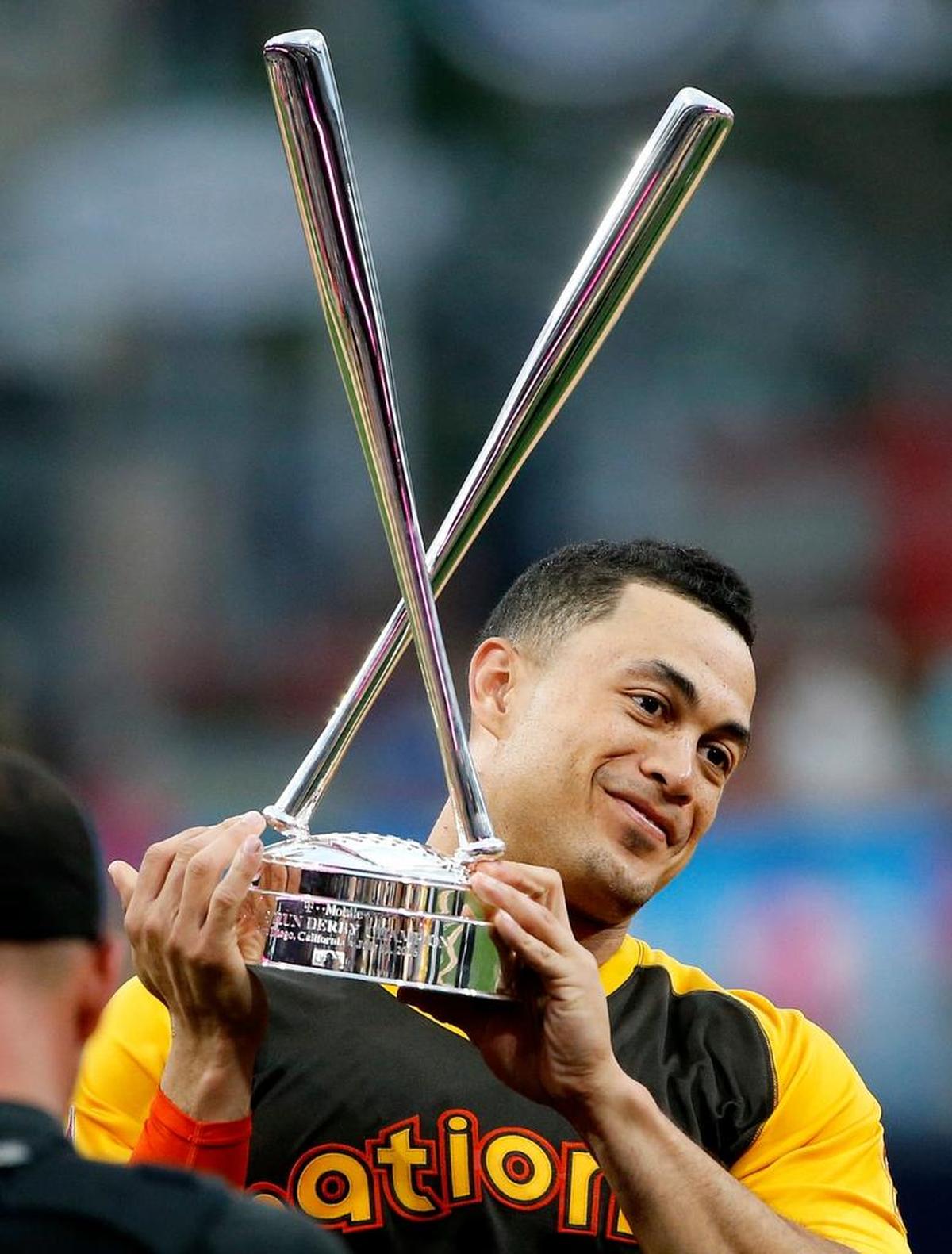 Giancarlo Stanton holds his trophy after winning the 2016 Home Run Derby in San Diego.