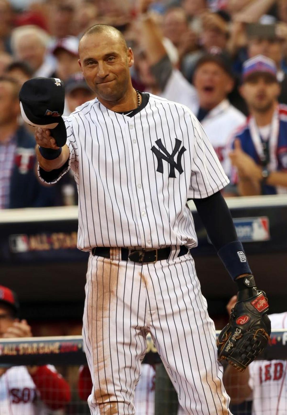 American League shortstop Derek Jeter, of the New York Yankees, waves as he is taken out of the game in the top of the fourth inning of the MLB All-Star baseball game, Tuesday, July 15, 2014, in Minneapolis.