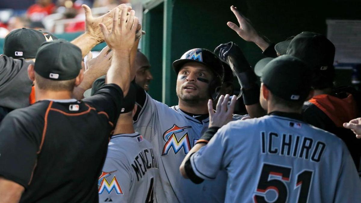 
Miami Marlins' Martin Prado, center, celebrates his two-run home run during the third inning against the Washington Nationals at Nationals Park, Friday, Aug. 28, 2015, in Washington. 
