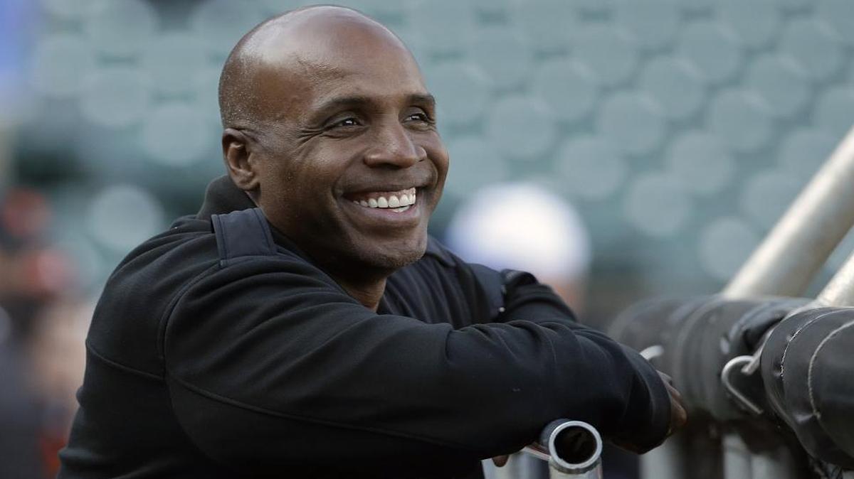 In this Aug. 25, 2015, file photo, former baseball player Barry Bonds smiles before a game between the San Francisco Giants and Chicago Cubs in San Francisco. Bonds is returning to baseball full time as hitting coach for the Miami Marlins.