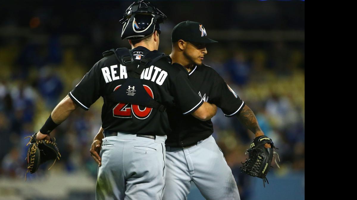
Catcher J.T. Realmuto and pitcher A.J. Ramos of the Miami Marlins congratulate one another after their 5-4 win against the Los Angeles Dodgers on May 13, 2015 in Los Angeles. 
