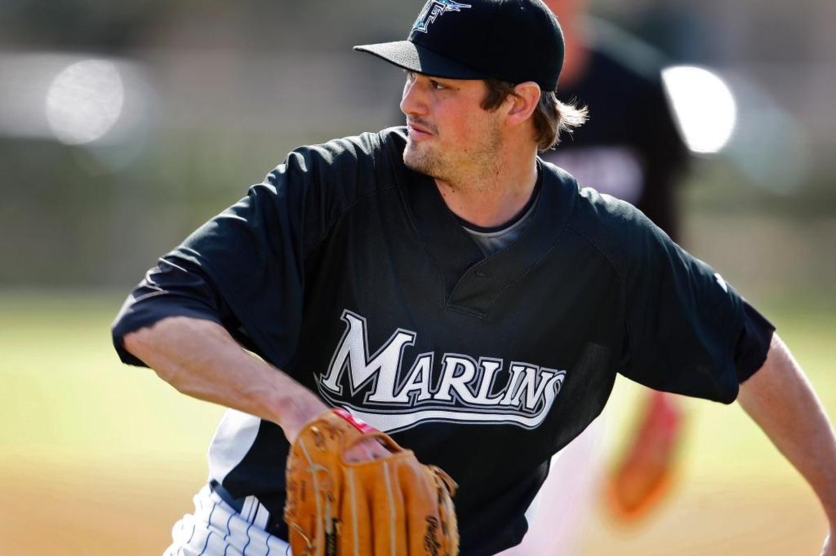 Marlins pitcher Andrew Miller throws to third base in drills up on first day of practice for pitchers and catchers on February 20, 2010.