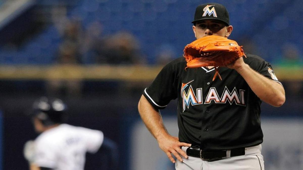 
Miami Marlins starter Jose Fernandez, right, waits for a new ball after giving up a solo home run to Tampa Bay Rays' Evan Longoria, left, during the first inning of a baseball game Thursday, Oct. 1, 2015, in St. Petersburg, Fla. 
