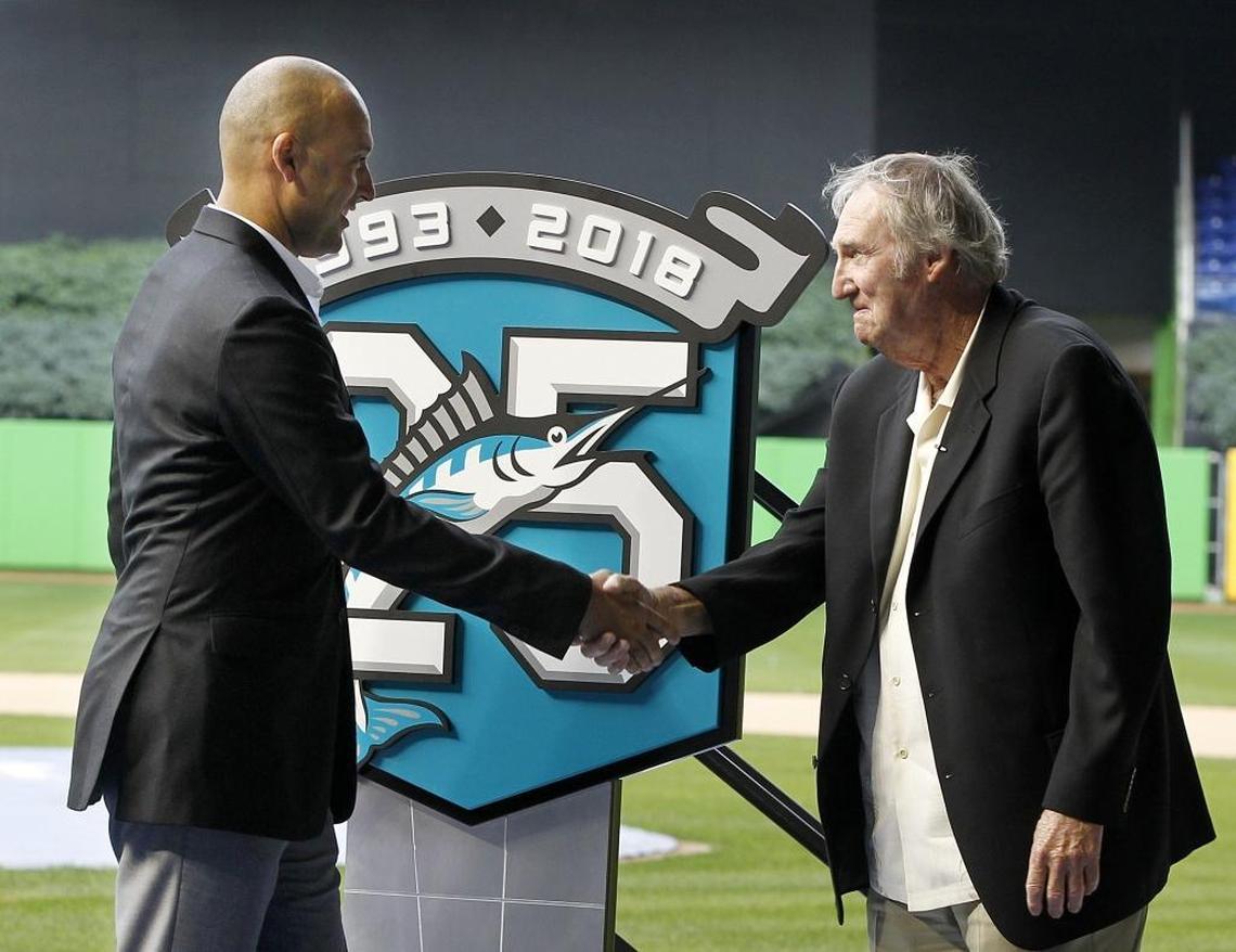 Marlins CEO Derek Jeter (left) and former Marlins pitcher Charlie Hough shake hands as they unveiled the 25th Anniversary logo to current Season Ticket Members who have had an account since 1993, during a special presentation to reveal details regarding the recognition of the franchise's 25th anniversary at Marlins Park in Miami on Tues., Feb. 6, 2018.