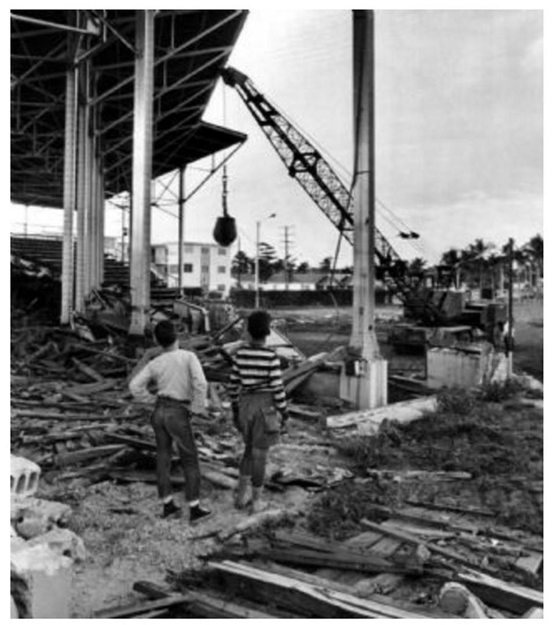 Neighborhood kids watch Miami Field — also known as Tatum Field — come down near the Orange Bowl in 1965. Marlins Park now sits on that site.
