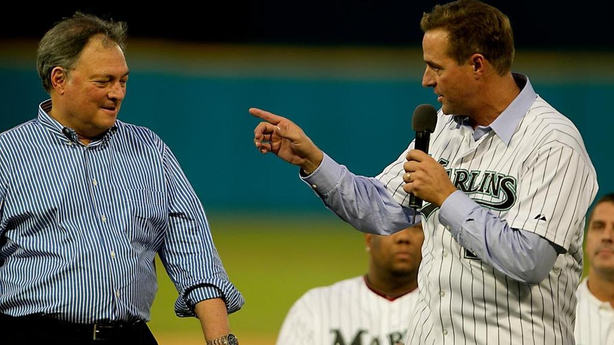 Miami Marlins owner Jeffery Loria listens to former pitcher Al Leiter during the Marlins’ last game at Sun Life Stadium against the Washington Nationals on Sept. 28, 2011.
