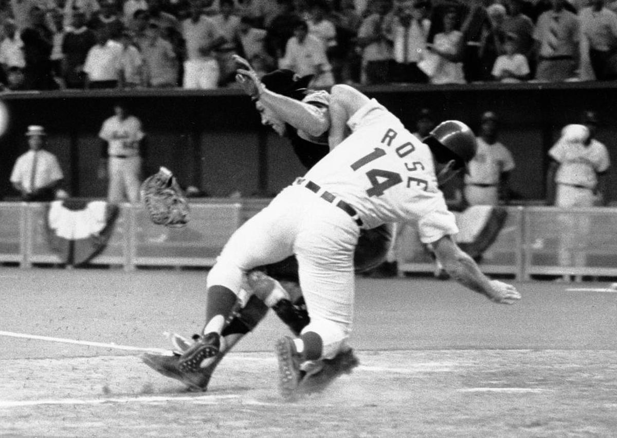 FILE - In this July 14, 1970, file photo, National League's Pete Rose collides with American League catcher Ray Fosse as he scores the winning run during the 12th inning of the 1970 All-Star Game in Cincinnati, Ohio. Fosse's body still aches all over 45 years later. He never did fully recover physically from one of most infamous plays in All-Star Game history.