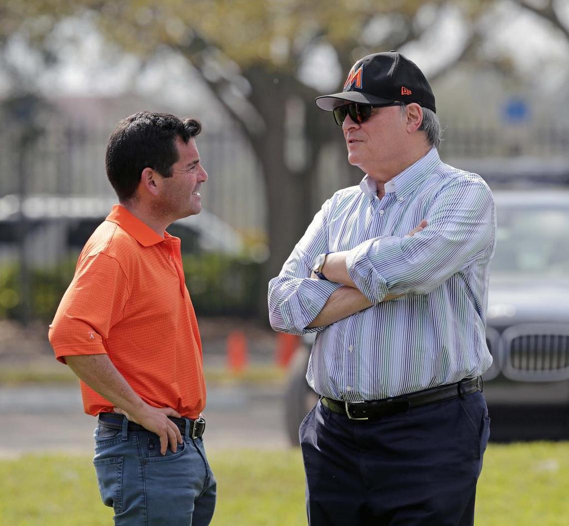 David Samson, former president of the Miami Marlins, speaks to past owner Jeffrey Loria during the first day of the team’s spring training in Jupiter on Tuesday, Feb. 14, 2017.