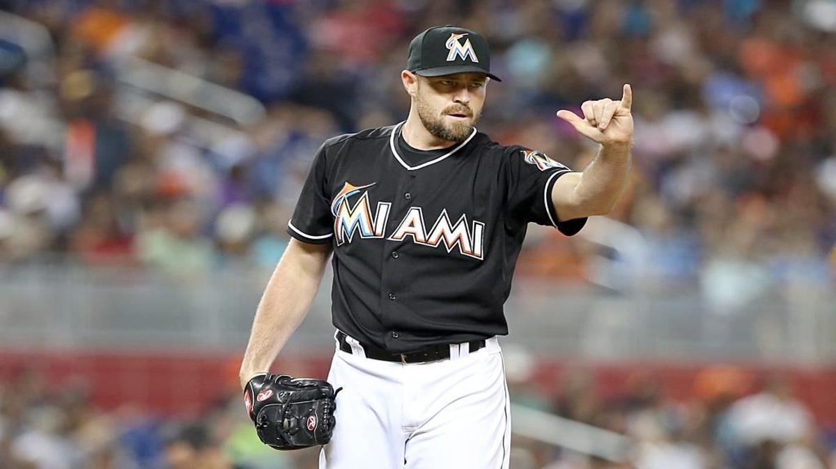 Mike Dunn gestures in the eighth inning of the Miami Marlins’ game against the Colorado Rockies at Marlins Park on Saturday, June 13, 2015.