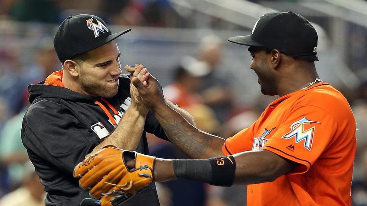 Marlins pitcher Jose Fernandez, left, is congratulated by teammate Marcell Ozuna after Fernandez struck out 14 batters in a 1-0 victory against the New York Mets in Miami.