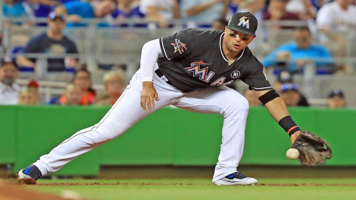 Miami Marlins third baseman Martin Prado (14) fields the ball as the Miami Marlins play the Los Angeles Dodgers at Marlins Park on Sat., July 15, 2017.