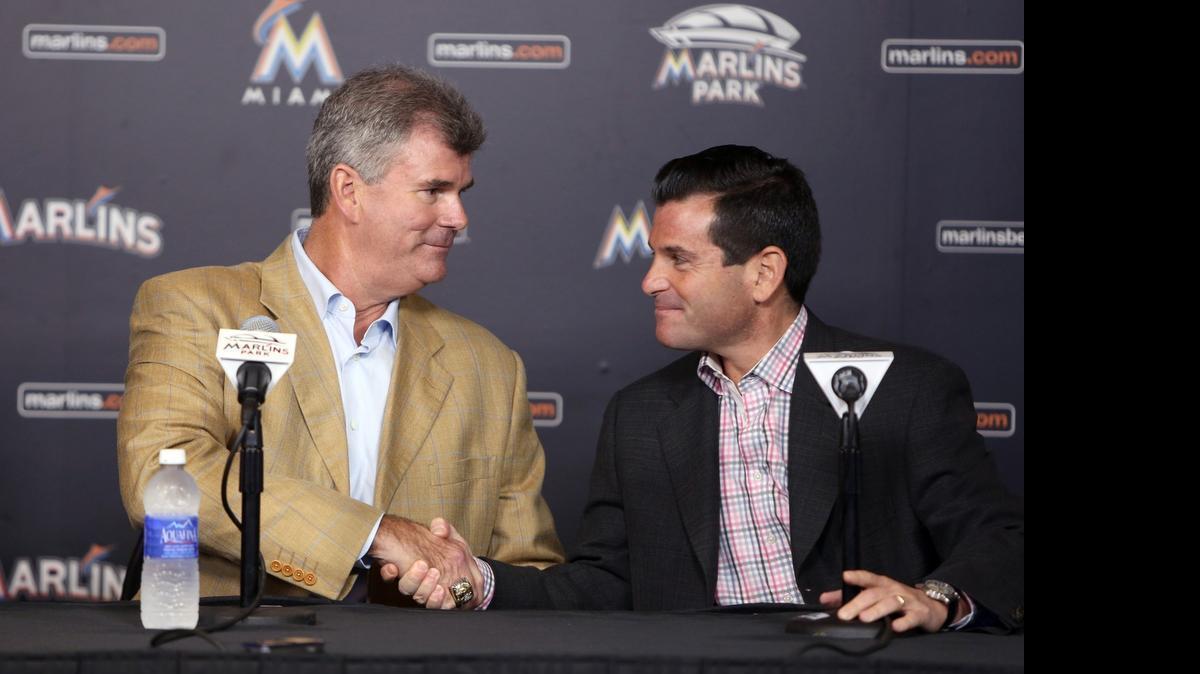 
Dan Jennings, left, the new manager of the Miami Marlins, shakes hands with team president David Samson during a news conference Monday, May 18, 2015.
