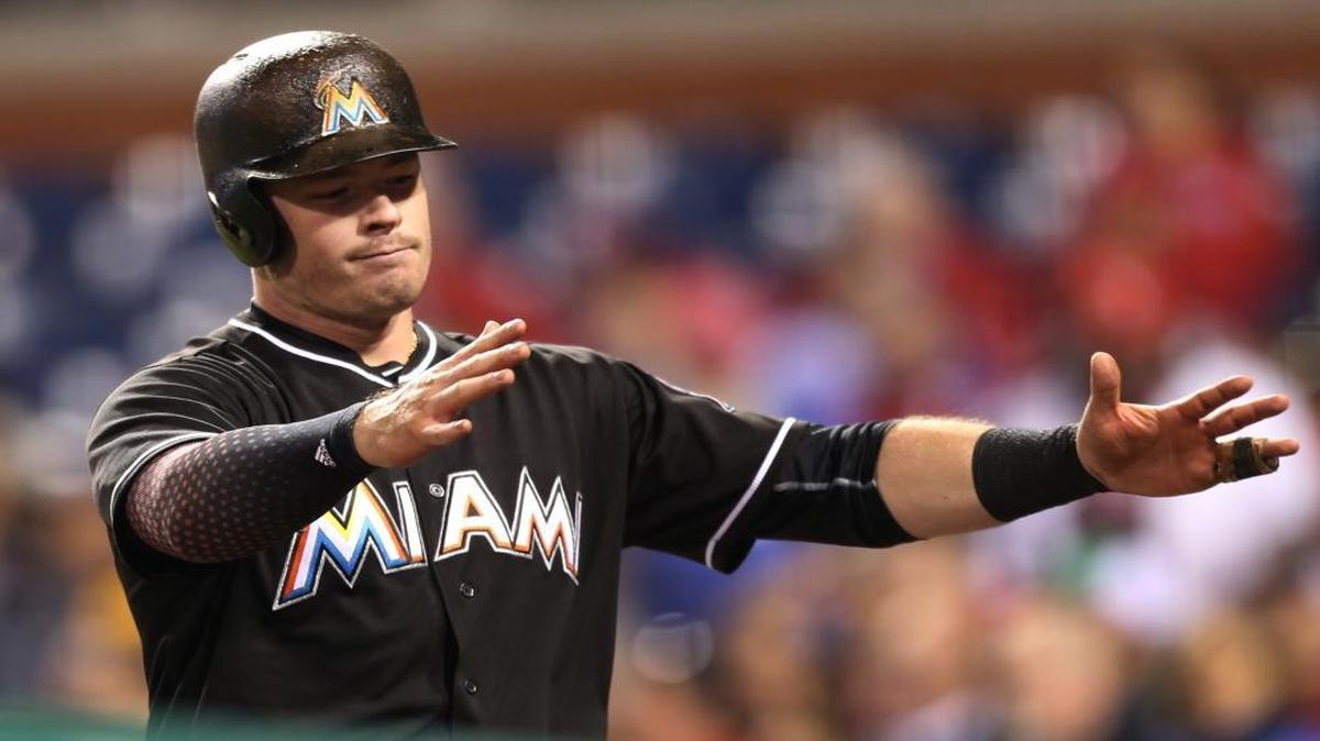 Miami Marlins' Justin Bour gestures to his team after hitting a home run on a pitch by Philadelphia Phillies starting pitcher Jerad Eickhoff in the sixth inning of a baseball game, Mon., May 16, 2016, in Philadelphia. The Marlins won 5-3.