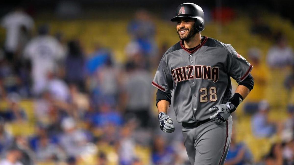 J.D. Martinez of the Arizona Diamondbacks smiles as he runs back to the dugout after hitting his fourth home run of Monday’s game at Dodger Stadium.