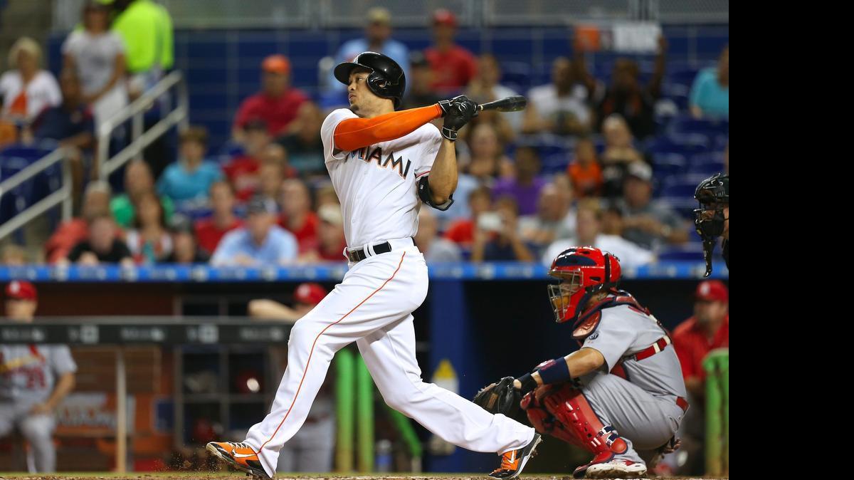 
Giancarlo Stanton of the Miami Marlins hits a solo home run in the second inning against the St. Louis Cardinals on Wednesday, June 24, 2015 at Marlins Park in Miami.
