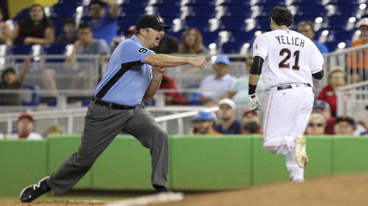 Miami Marlins' Christian Yelich (21) gets tagged out after hitting a ground ball and running to first base in the ninth inning against the Philadelphia Phillies at Marlins Park in Little Havana on Mon., Sept. 5, 2016.