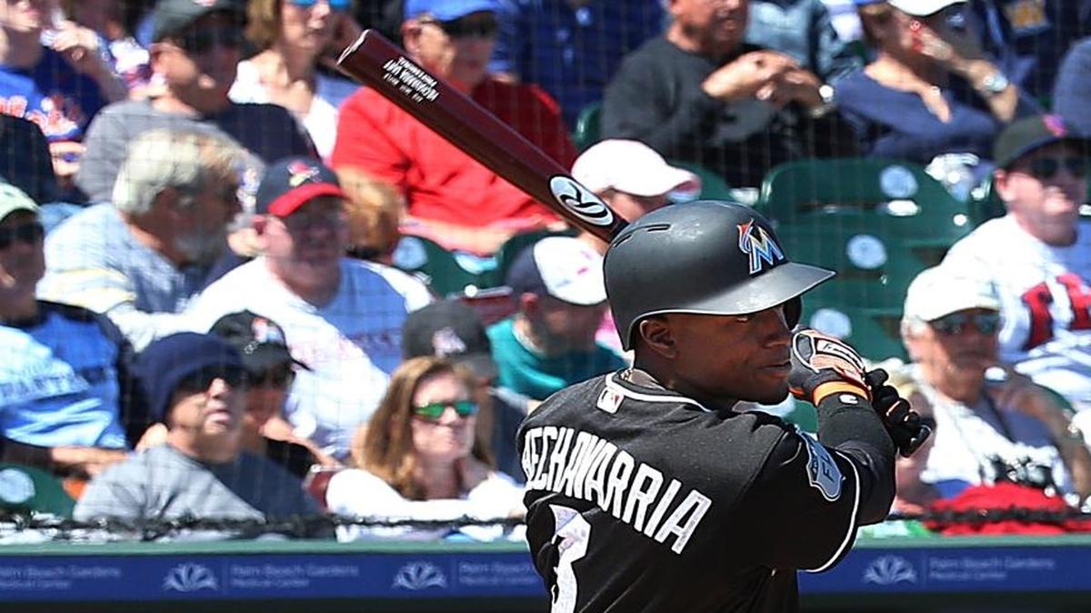 Miami Marlins shortstop Adeiny Hechavarria hits a single in the second inning of the team’s spring training game against the New York Mets at Roger Dean Stadium in Jupiter on March 15, 2017.