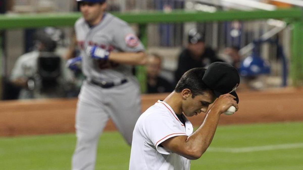 
A disconsolate Steve Cishek reacts as Daniel Murphy rounds the bases after his three-run homer put the Mets ahead 3-1 in the ninth inning. 
