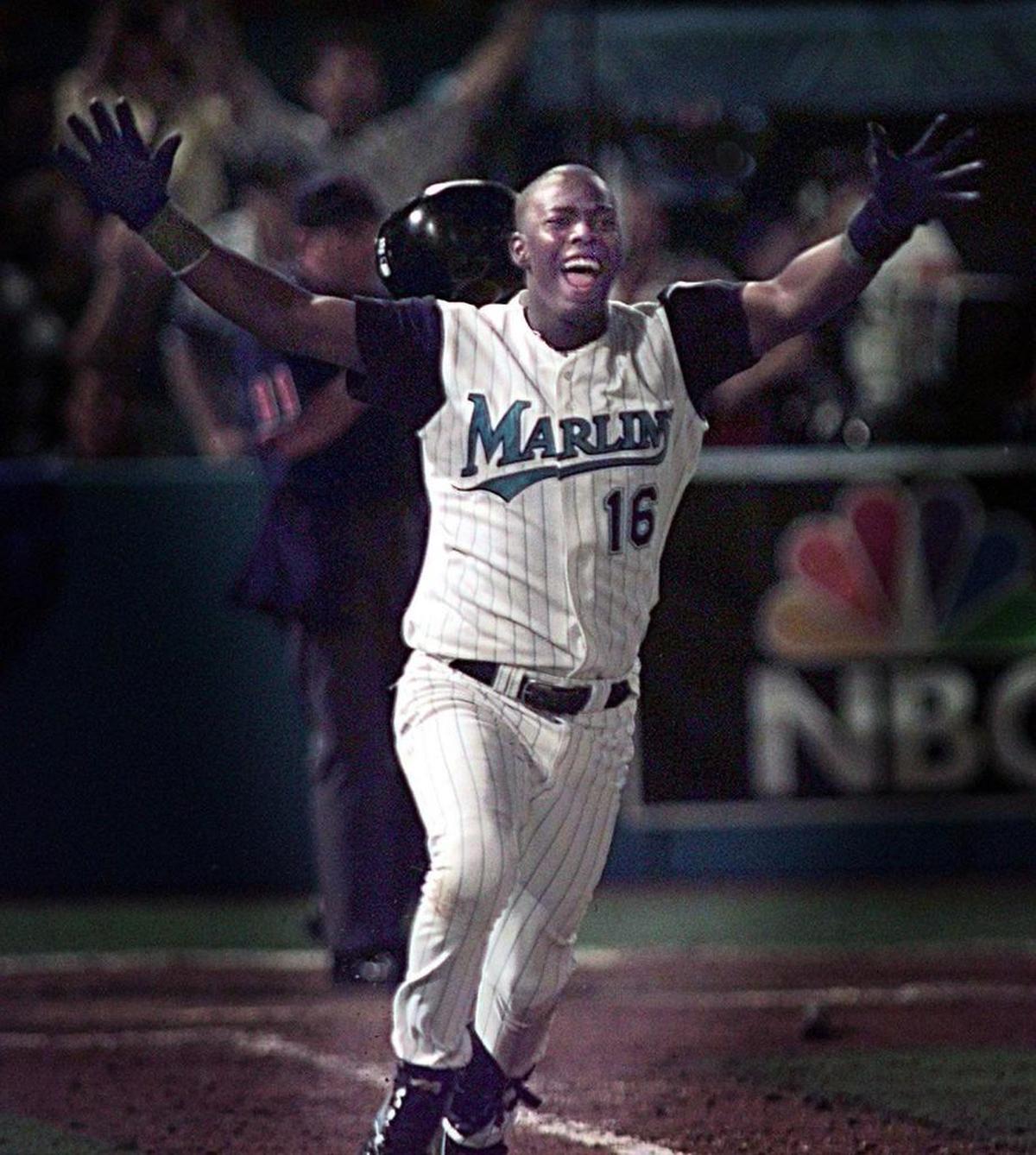 A jubilant Edgar Renteria runs toward first base after singling in the game-winning run in the bottom of the 11th inning leading the Florida Marlins to the 1997 World Series championship.