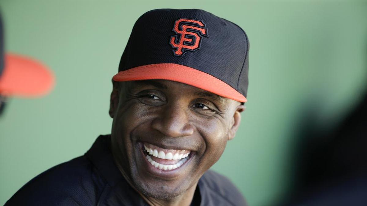 In this March 10, 2014, file photo, former San Francisco Giants Barry Bonds chats to the dugout during a spring training baseball game in Scottsdale, Ariz. Bonds' obstruction of justice conviction reversed by 9th US Circuit Court of Appeals on Wednesday, April 22, 2015.