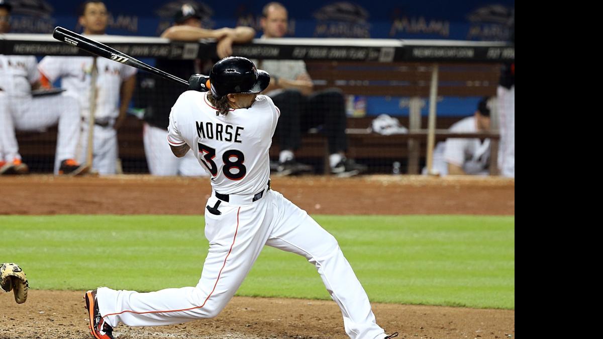 
Miami Marlins first baseman Michael Morse singles in the eighth inning to drive in Martin Prado with the go-ahead (and eventual winning) run against the New York Mets at Marlins Park on Tuesday, April 28, 2015.
