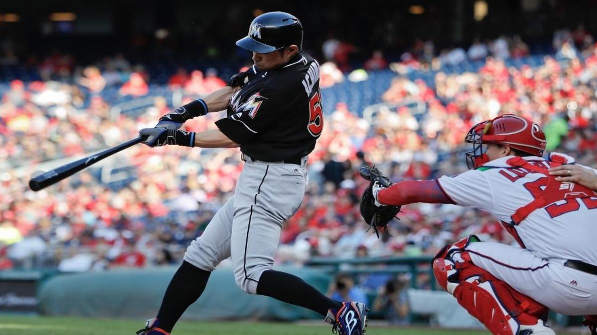 Miami Marlins Ichiro Suzuki, from Japan, connects for a single off Washington Nationals Max Scherzer during the fifth inning at Nationals Park, Sunday, Oct. 2, 2016 in Washington. Behind the plate is Nationals catcher Jose Lobaton.