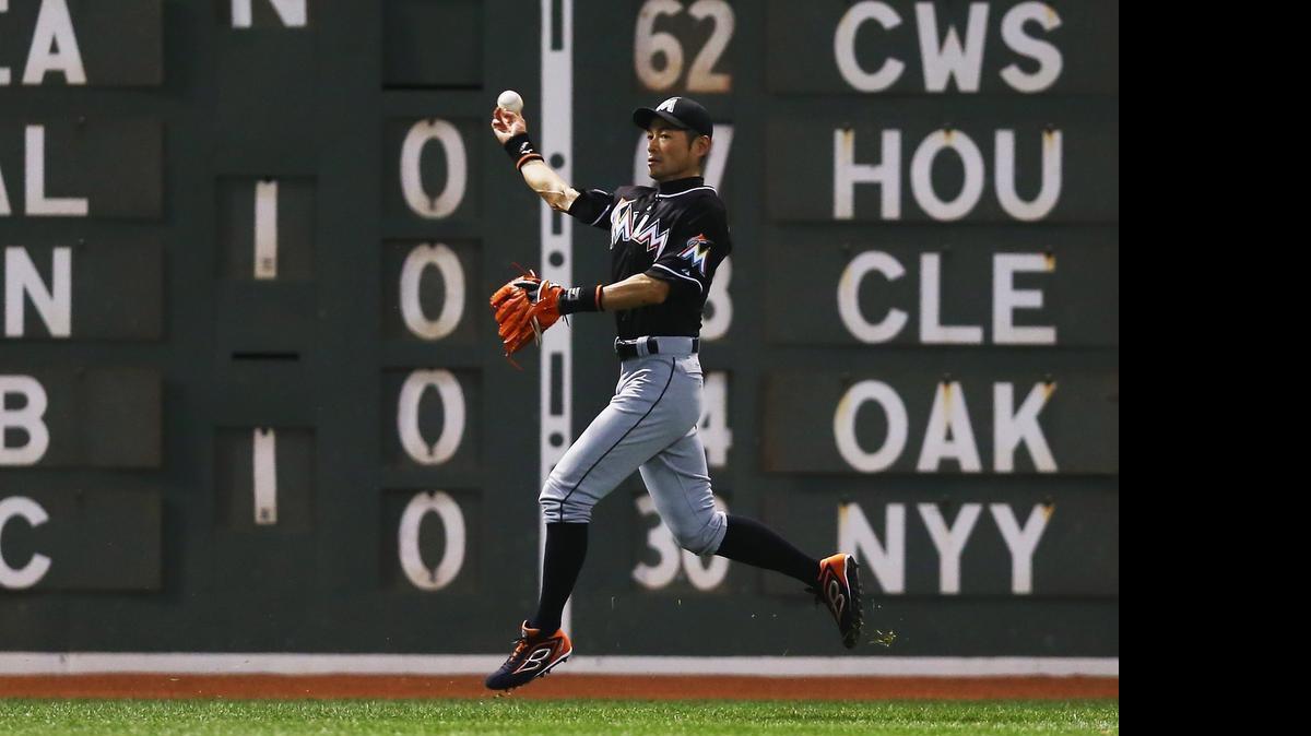 
Ichiro Suzuki of the Miami Marlins throws toward home during the fifth inning against the Red Sox at Fenway Park on July 7, 2015 in Boston. 
