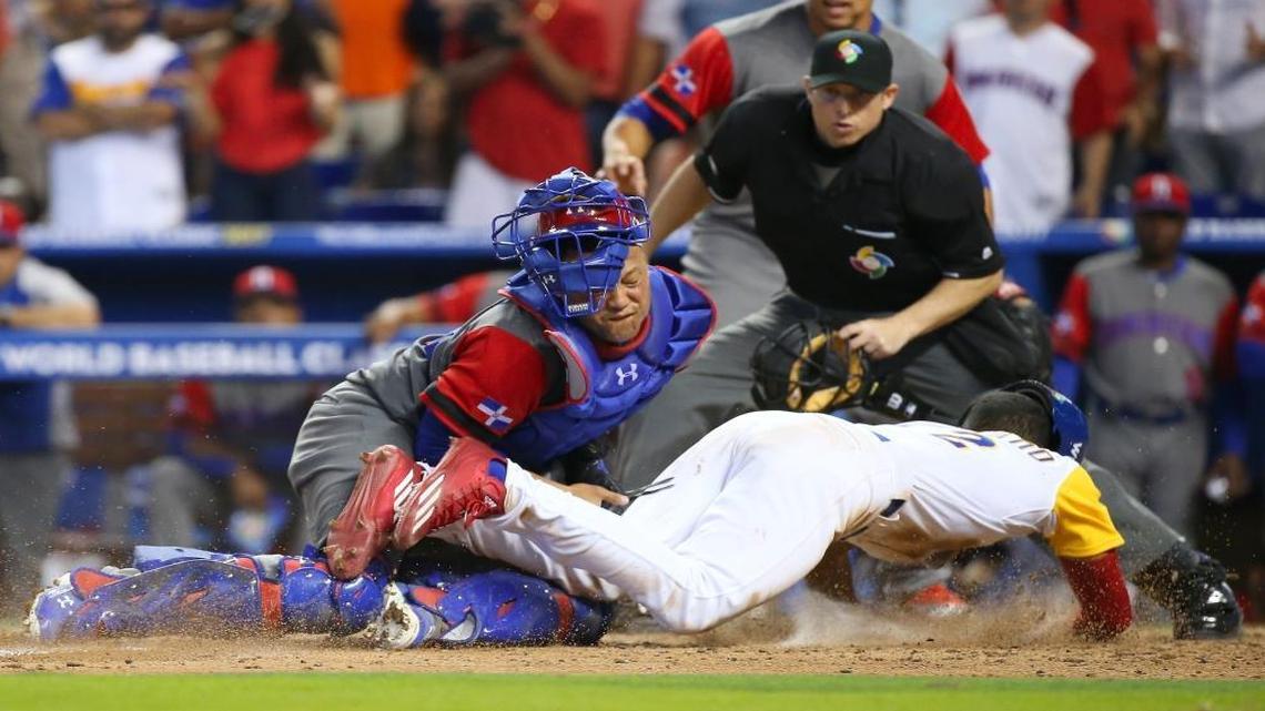 Dominican Republic catcher Welington Castillo tag out Colombia pinch runner Oscar Mercado during the ninth inning of a World Baseball Classic first round Pool C game at Marlins Park on Sunday, March 12, 2017, in Miami.