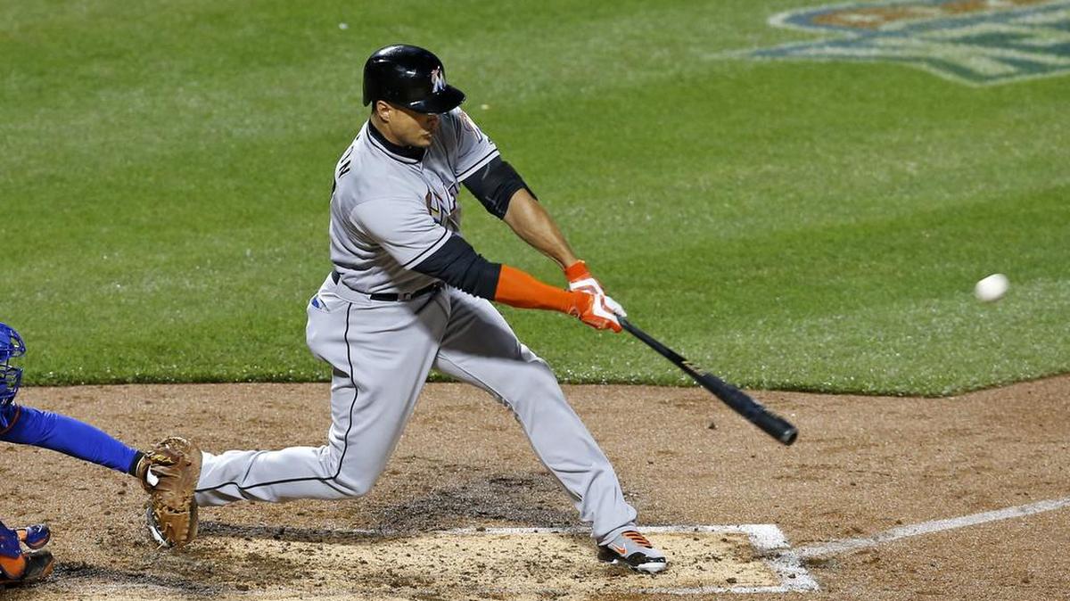 The Marlins’ Giancarlo Stanton hits a second-inning, two-run home run against Mets pitcher Steven Matz on Monday night at Citi Field.