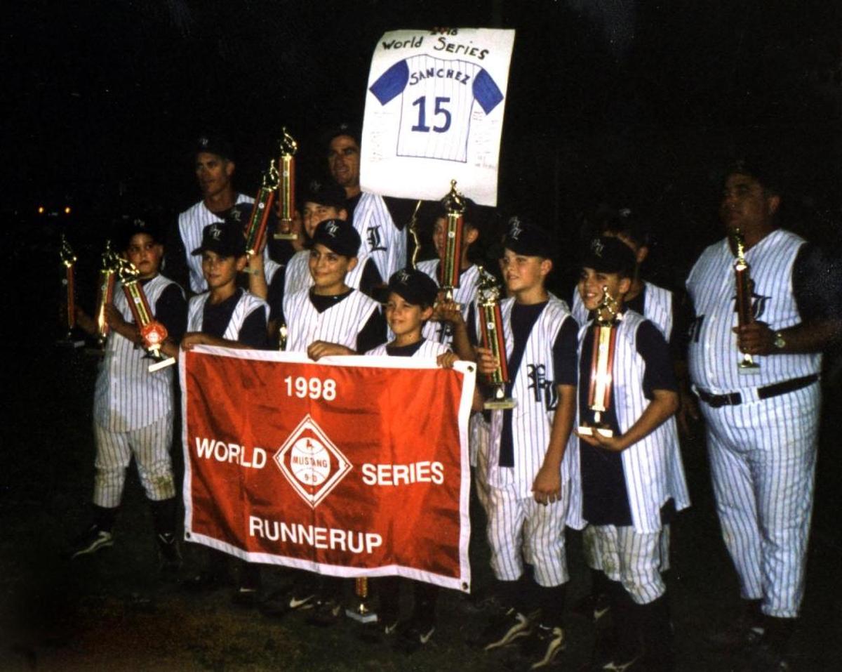 The 1998 Pembroke Lakes Optimist Mustang All-Star team featured future major leaguer J.D. Martinez (second from right, second row holding a trophy).