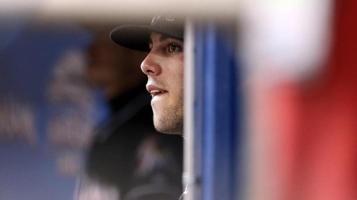 Marlins pitcher Jose Fernandez watches the game from the dugout during a game against St Louis at Marlins Park, July 28.