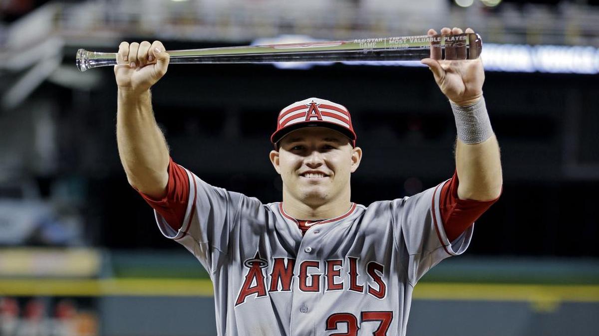 American League's Mike Trout, of the Los Angeles Angels, holds the MVP trophy after the MLB All-Star baseball game, Tuesday, July 14, 2015, in Cincinnati. The American League won 6-3.