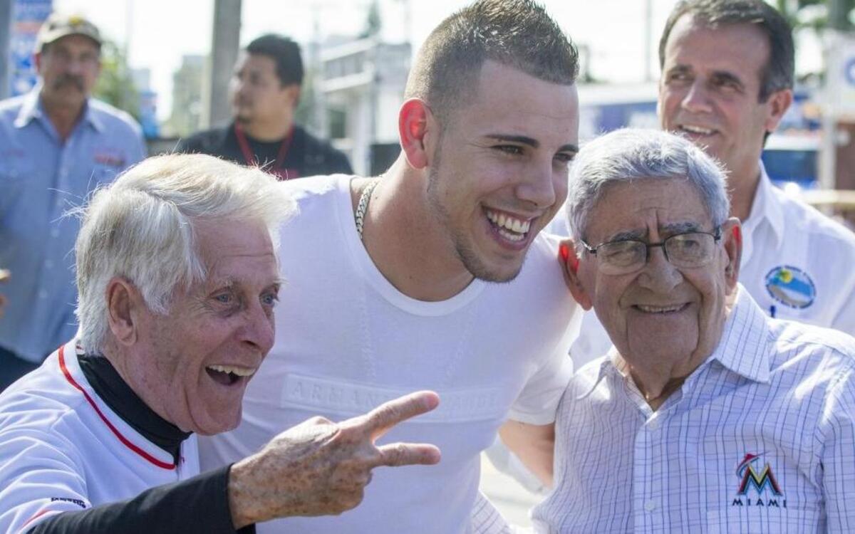 Miami Marlins pitcher Jose Fernandez, center, poses with radio personality Eduardo Gonzalez Rubio, left, and Rafael ‘Felo’ Ramirez, Marlins Spanish play-by-play announcer, right, before the start of the Three Kings Day Parade on Jan. 12, 2014, in Miami. Ramirez said ‘we were in the presence of someone tremendous. He had great enthusiasm all the time. He was unforgettable.’