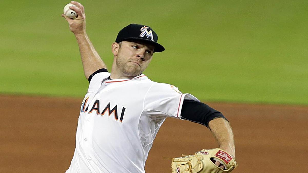 
David Phelps pitches for the Miami Marlins in the first inning against the Cincinnati Reds at Marlins Park in Miami on Friday, July 10, 2015.
