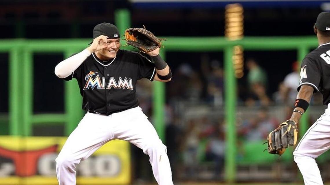 Miami Marlins’ Miguel Rojas (left) and Dee Gordon (right) celebrate their 2-0 victory over the Washington Nationals on Saturday, September 12, 2015, at Marlins Park.